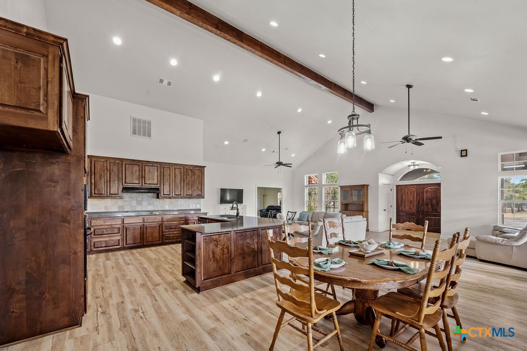 2795 Highway 290 Dripping Springs, TX 78620 - Photo 9 of 40 a large kitchen with a table and chairs in it