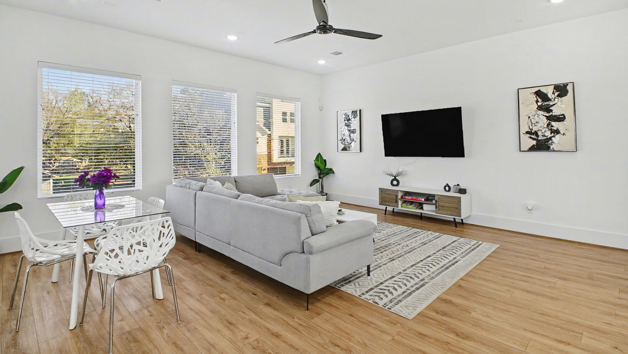 2802 Tierwester Street Houston, TX 77004 - Photo 12 of 35 a living room with furniture and a flat screen tv