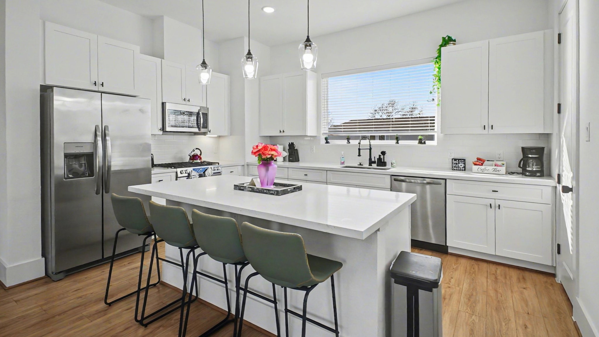 2802 Tierwester Street Houston, TX 77004 - Photo 14 of 35 a kitchen with a sink a refrigerator and cabinets