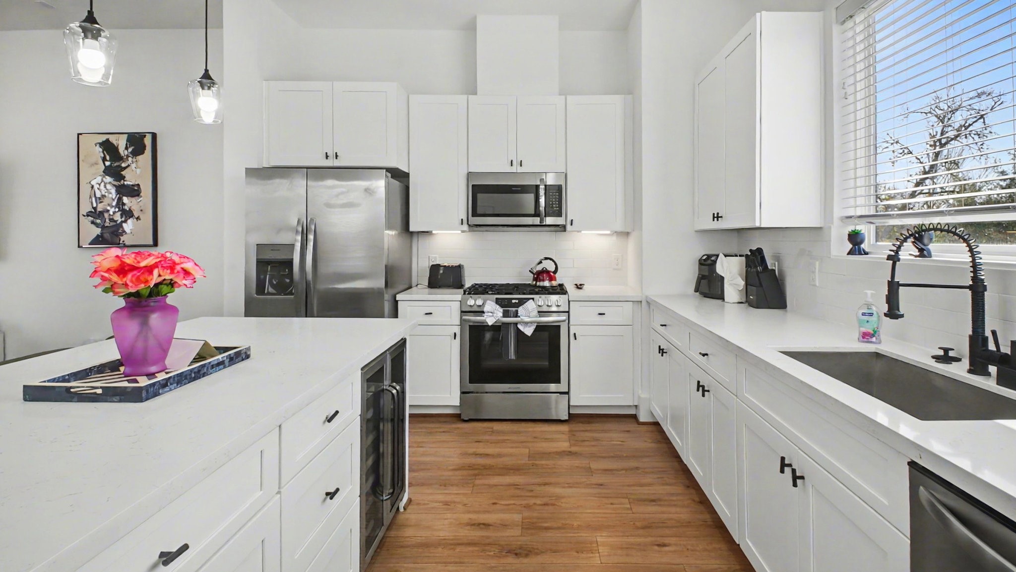 2802 Tierwester Street Houston, TX 77004 - Photo 16 of 35 a kitchen with stainless steel appliances granite countertop a refrigerator sink and cabinets