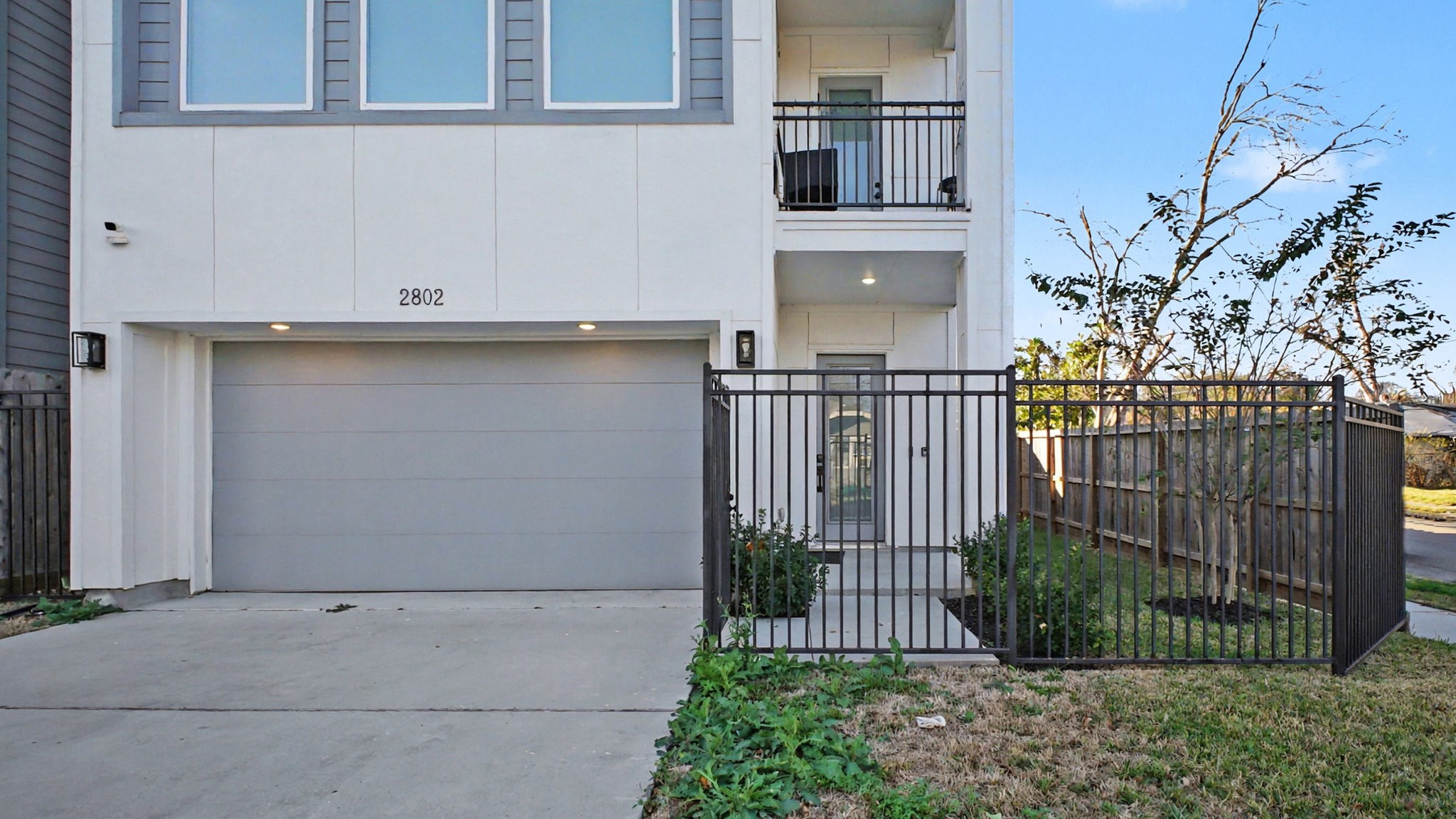 2802 Tierwester Street Houston, TX 77004 - Photo 2 of 35 a view of a house with a small yard and plants