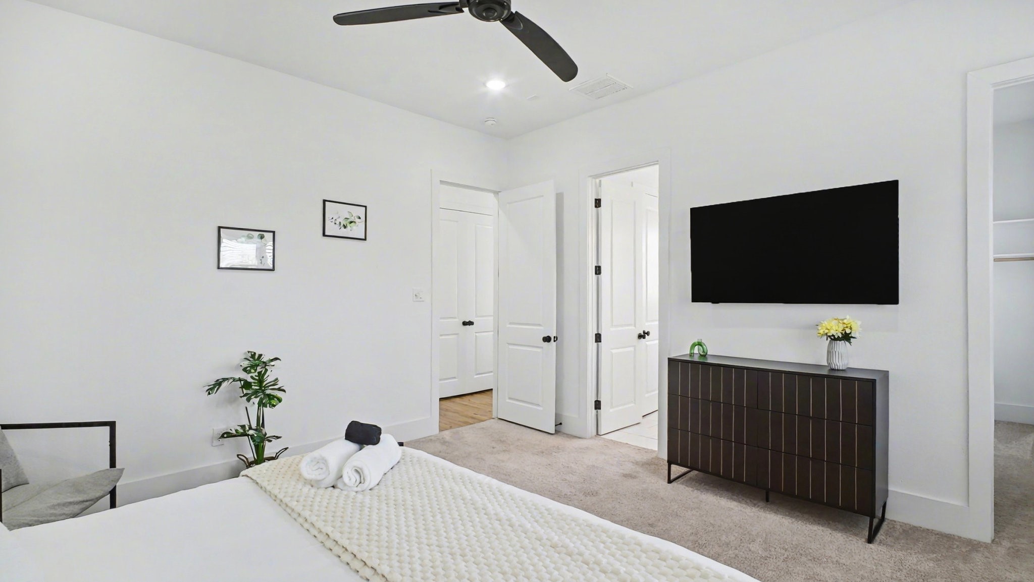 2802 Tierwester Street Houston, TX 77004 - Photo 21 of 35 a bedroom with a bed and a flat screen tv