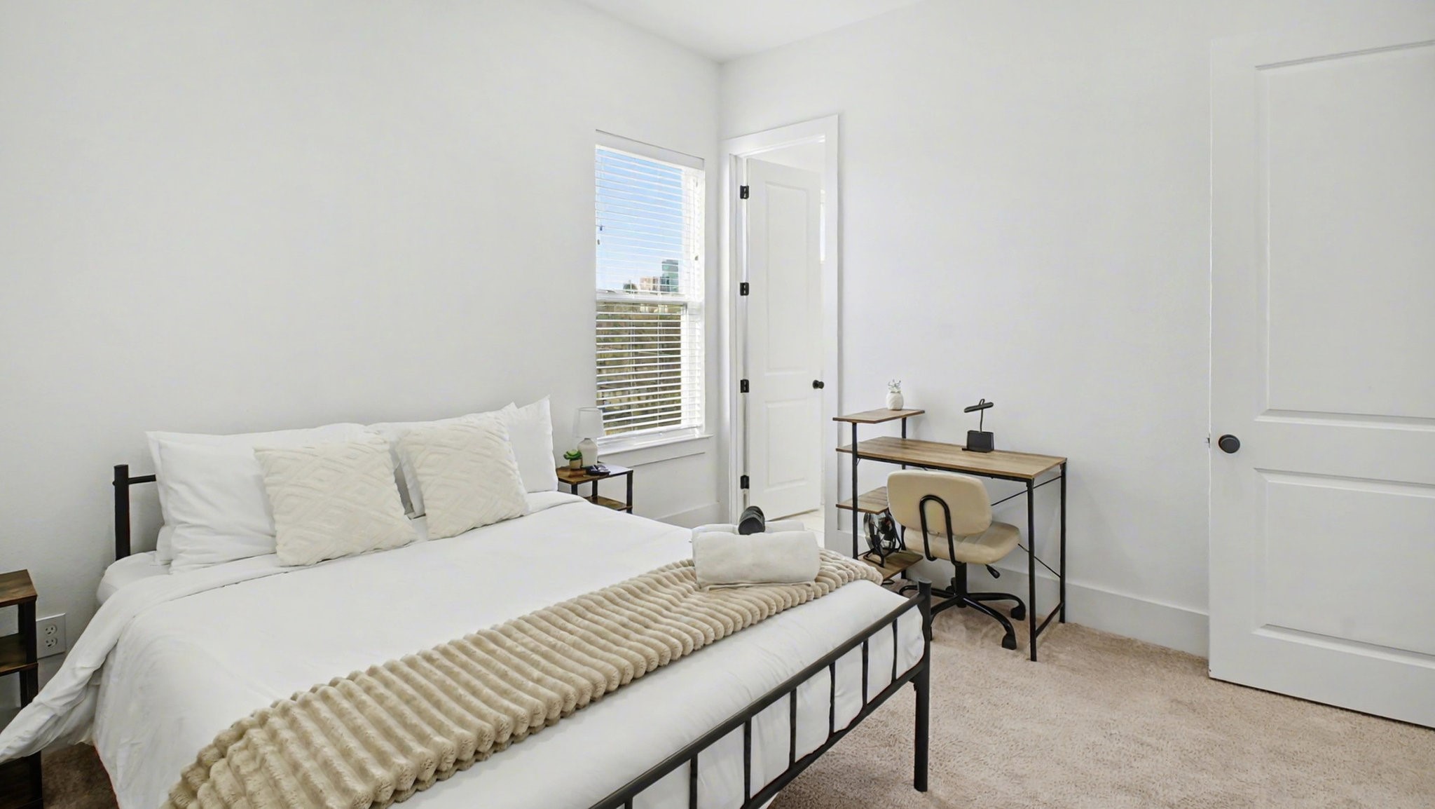 2802 Tierwester Street Houston, TX 77004 - Photo 28 of 35 a bedroom with a bed and a table