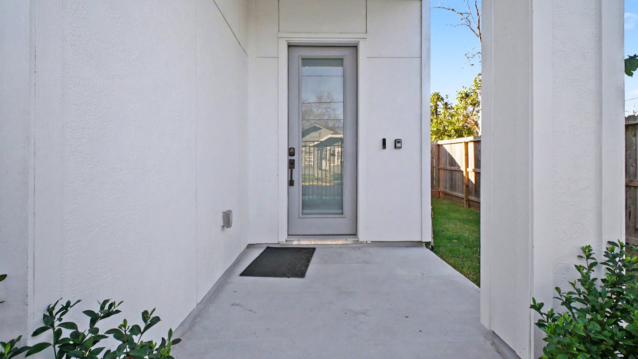 2802 Tierwester Street Houston, TX 77004 - Photo 4 of 35 a view of a hallway with wooden floor and a potted plant