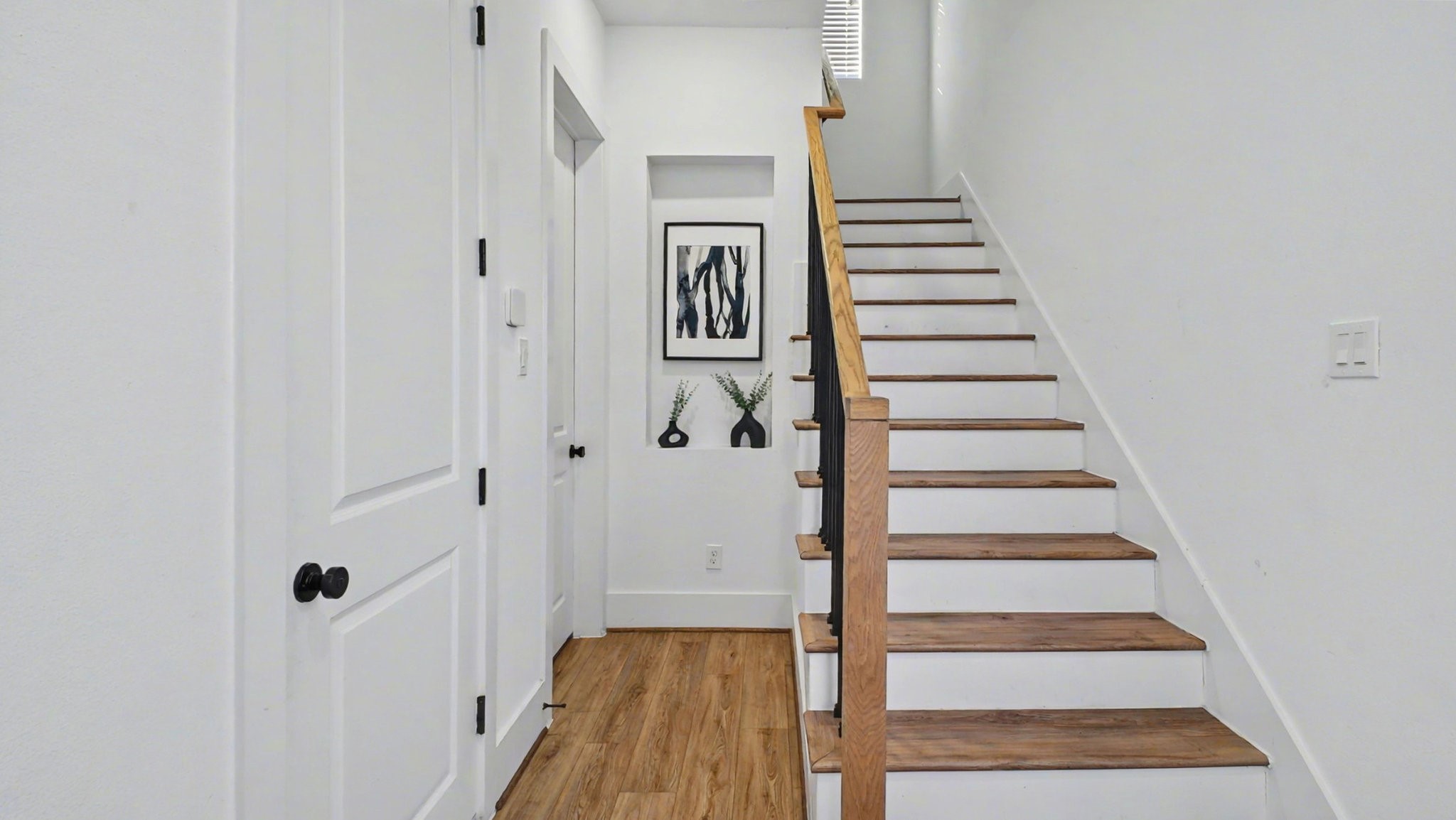 2802 Tierwester Street Houston, TX 77004 - Photo 5 of 35 a view of a hallway with wooden floor and entryway