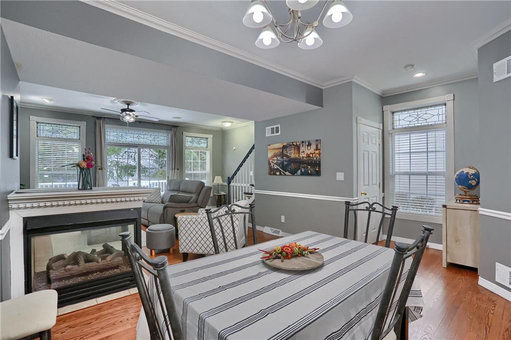 201 Beech Street Gibsonia, PA 15044 - Photo 14 of 49 a view of a dining room with furniture a chandelier and wooden floor