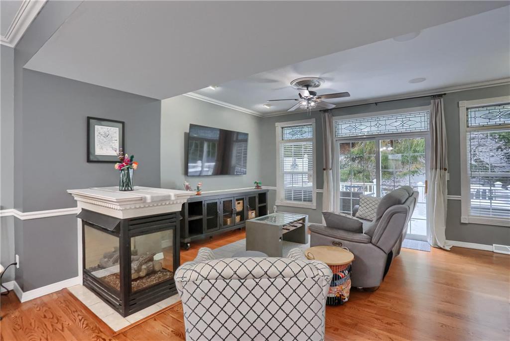 201 Beech Street Gibsonia, PA 15044 - Photo 15 of 49 a living room with furniture a flat screen tv and a floor to ceiling window