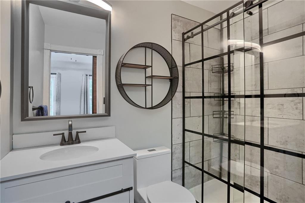 201 Beech Street Gibsonia, PA 15044 - Photo 29 of 49 a bathroom with a sink a toilet and a mirror