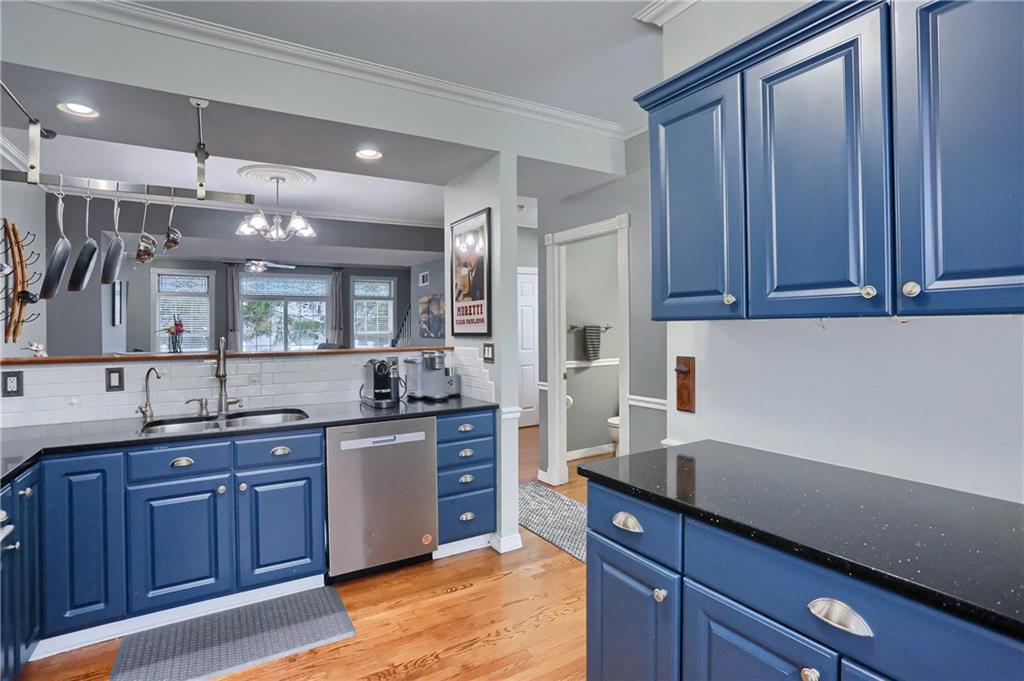201 Beech Street Gibsonia, PA 15044 - Photo 8 of 49 a kitchen with granite countertop stainless steel appliances a sink and wooden cabinets