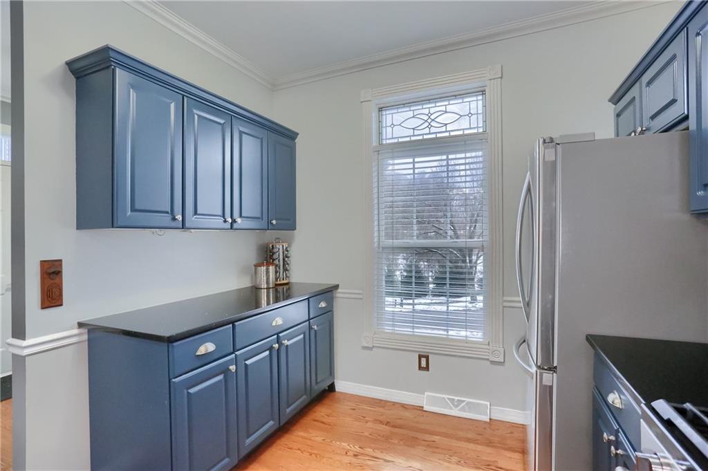 201 Beech Street Gibsonia, PA 15044 - Photo 9 of 49 a kitchen with stainless steel appliances granite countertop a sink dishwasher a refrigerator and cabinets with wooden floor