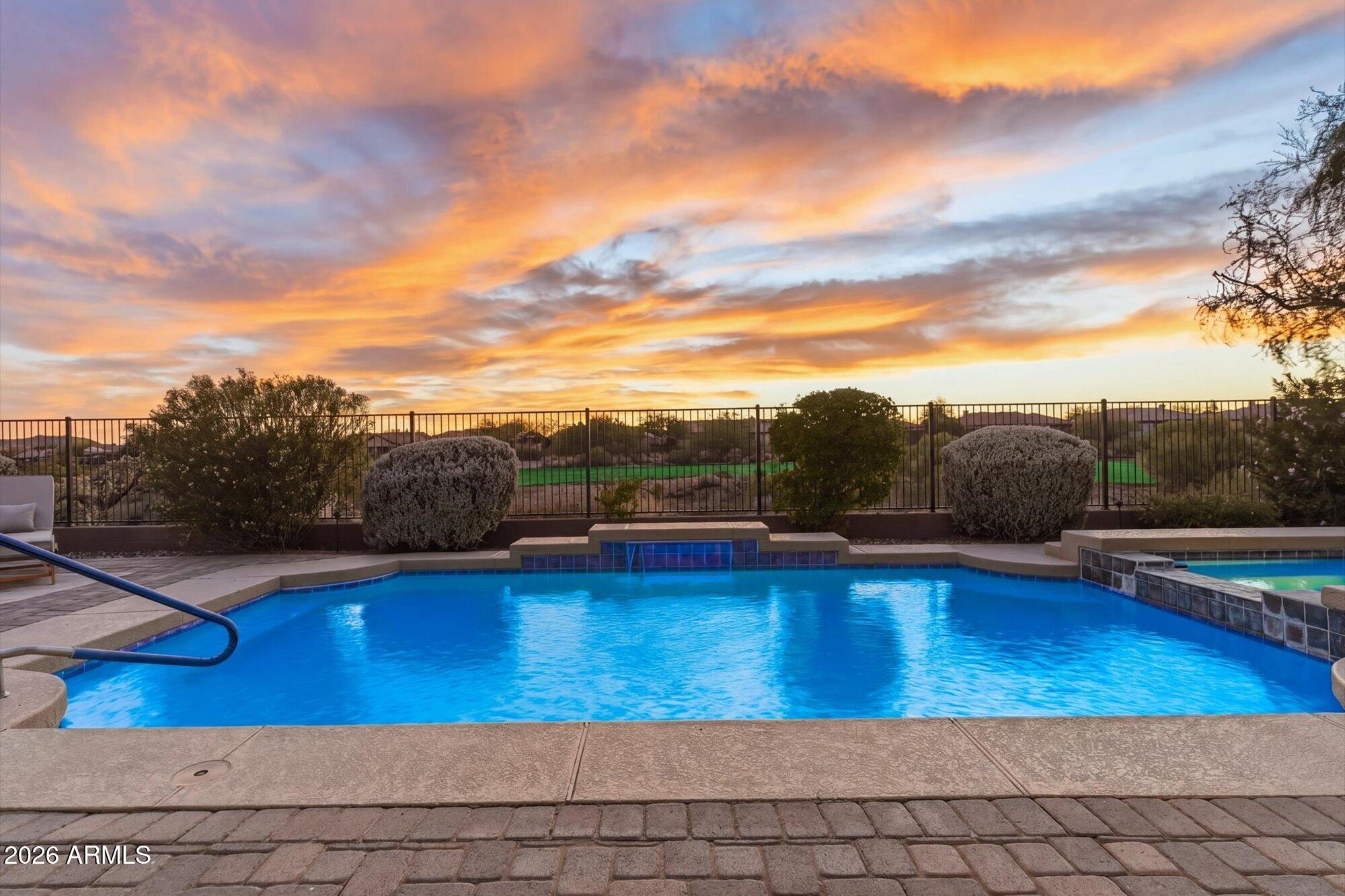 40322 North Hawk Ridge Trail Anthem, AZ 85086 - Photo 5 of 63 a view of a swimming pool and lounge chair