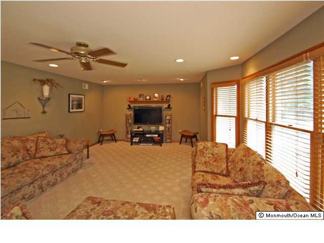 2314 Hollywood Road Point Pleasant, NJ 08742 - Photo 2 of 3 a living room with furniture window and flat screen tv