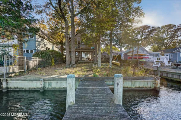 a swimming pool view with a seating space
