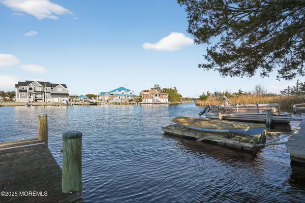 a view of a lake with houses in the back