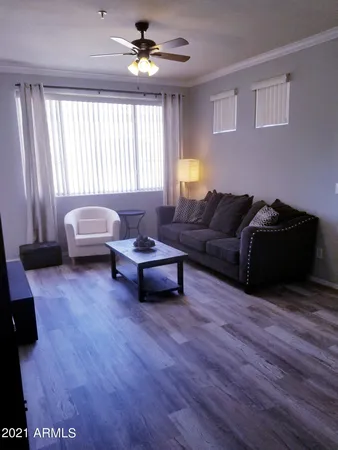 a living room with furniture and a window