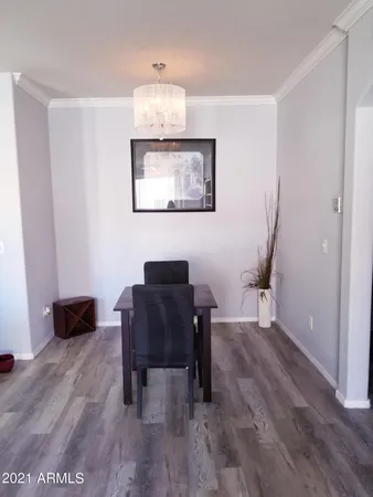 a workspace with furniture and wooden floor
