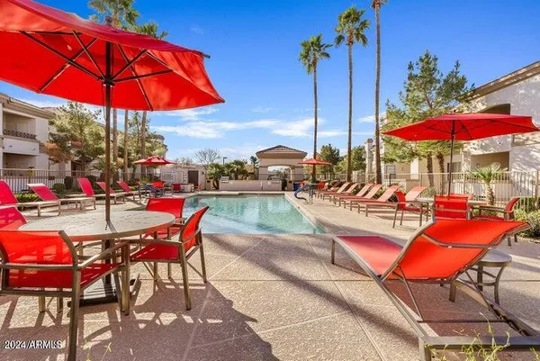 an outdoor space with patio furniture and tables