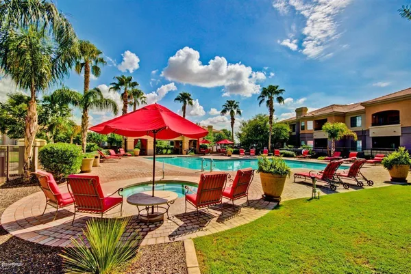 a view of a swimming pool with sitting area