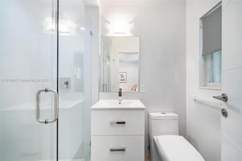 a bathroom with a toilet and a sink
