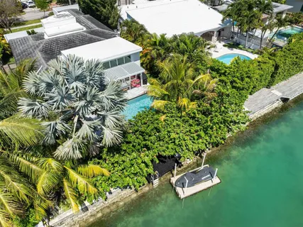 an aerial view of houses with an outdoor space