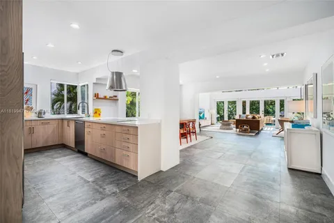 a view of a dining room with furniture water and chandelier