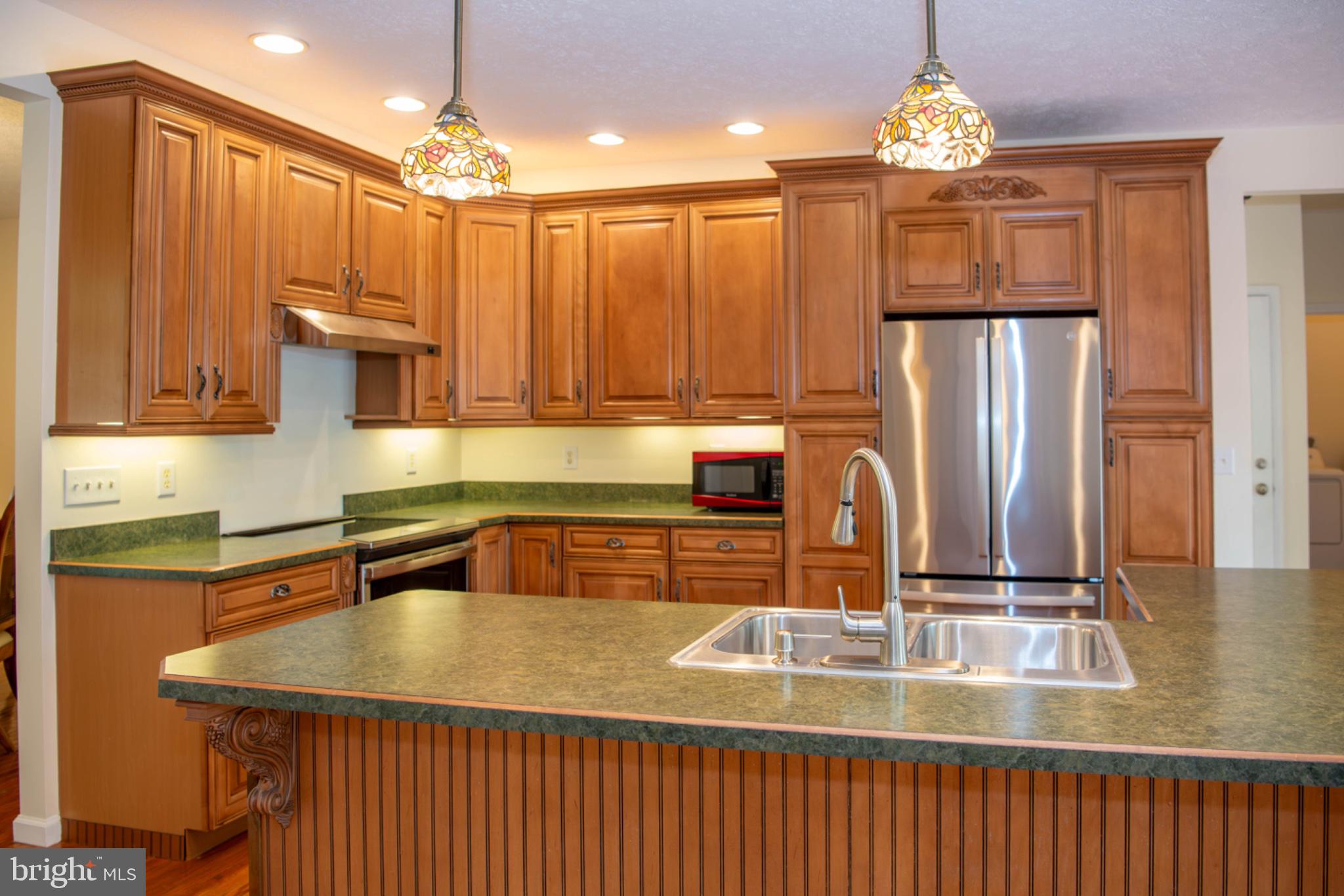 792 Forest Glen Road Moorefield, WV 26836 - Photo 34 of 146 Warm wood tones in a stylish kitchen.