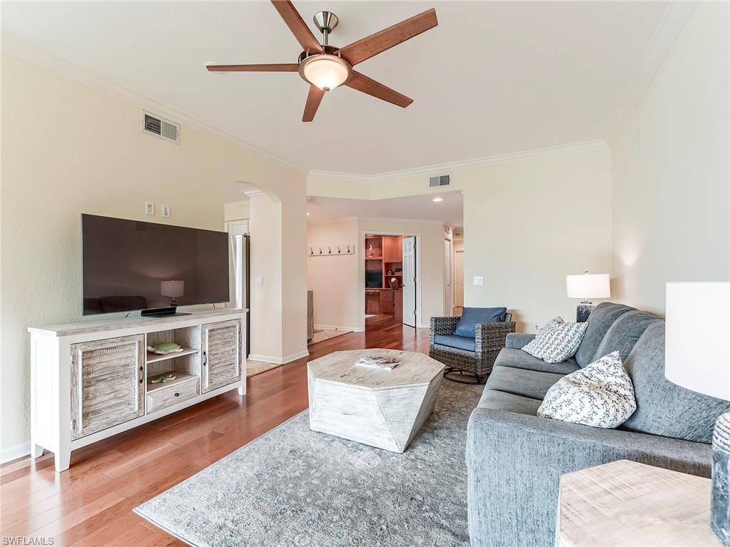 22921 Rosedale Drive, Unit 102 Estero, FL 34135 - Photo 11 of 33 a living room with furniture and a flat screen tv