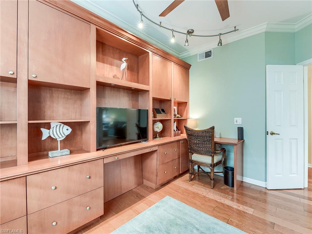 22921 Rosedale Drive, Unit 102 Estero, FL 34135 - Photo 19 of 33 a kitchen with stainless steel appliances granite countertop a sink and cabinets