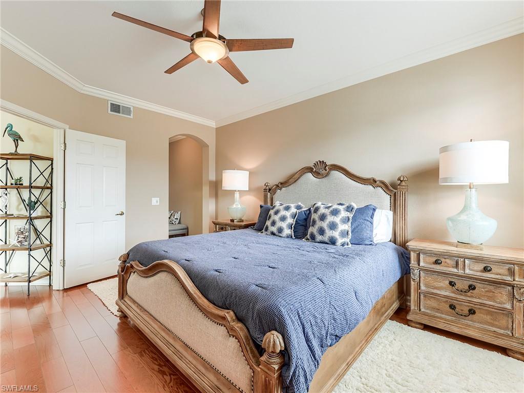 22921 Rosedale Drive, Unit 102 Estero, FL 34135 - Photo 20 of 33 a bedroom with a bed and a dresser