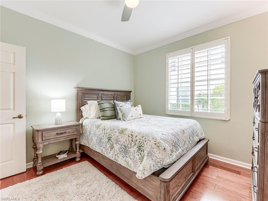 22921 Rosedale Drive, Unit 102 Estero, FL 34135 - Photo 26 of 33 a bed sitting in a bedroom next to a window