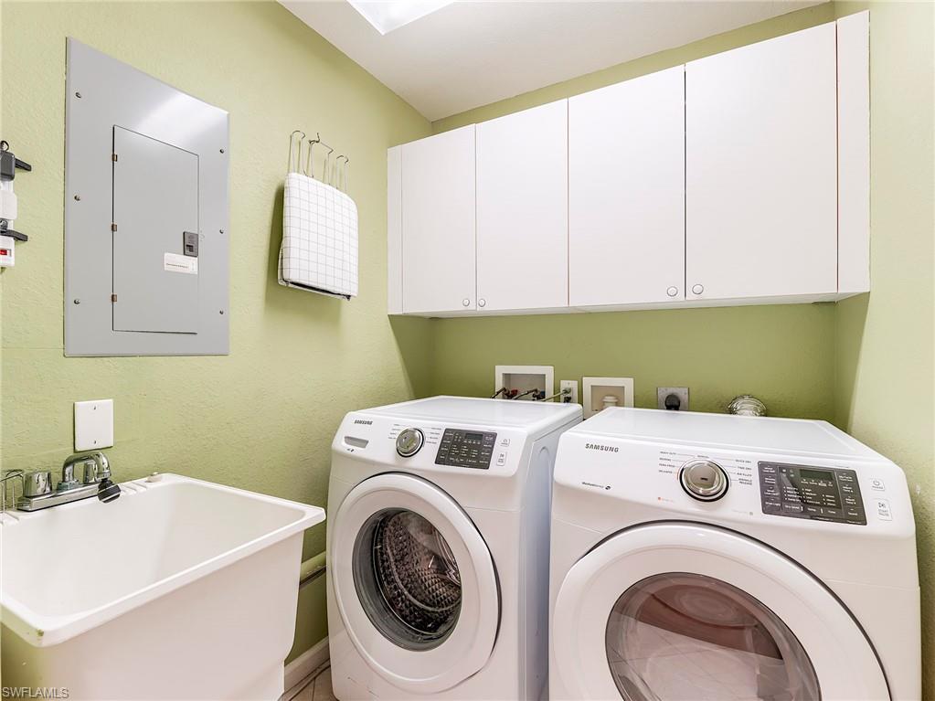 22921 Rosedale Drive, Unit 102 Estero, FL 34135 - Photo 28 of 33 a utility room with dryer and washer