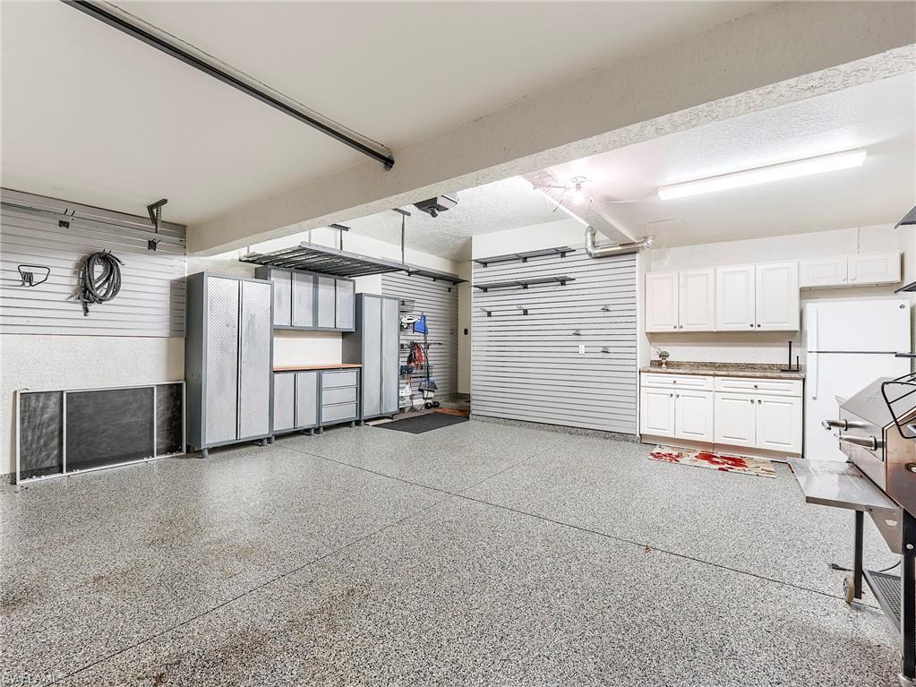 22921 Rosedale Drive, Unit 102 Estero, FL 34135 - Photo 30 of 33 a view of a garage