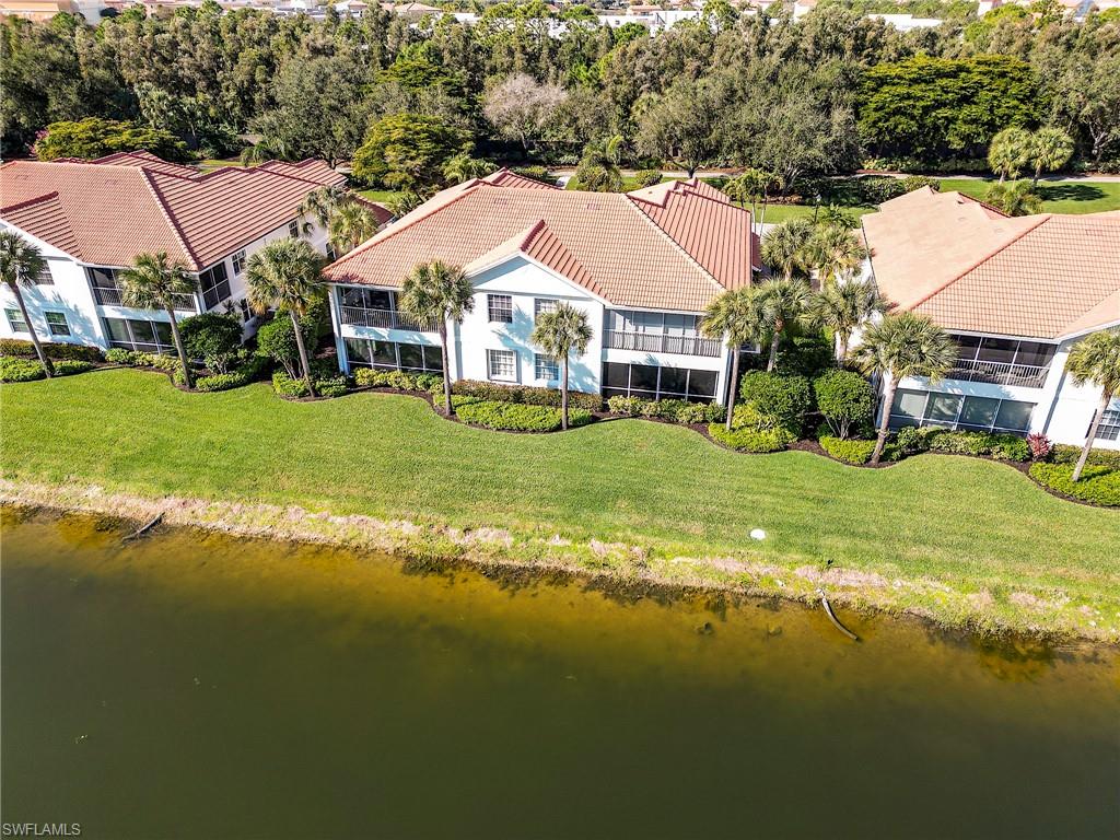 22921 Rosedale Drive, Unit 102 Estero, FL 34135 - Photo 32 of 33 a view of a house with a big yard
