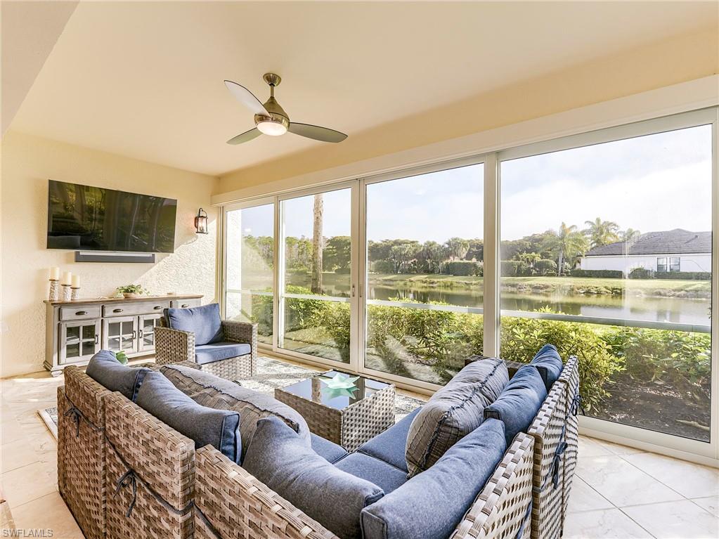 22921 Rosedale Drive, Unit 102 Estero, FL 34135 - Photo 5 of 33 a living room with furniture and a flat screen tv