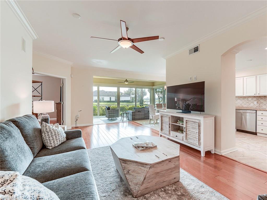 22921 Rosedale Drive, Unit 102 Estero, FL 34135 - Photo 9 of 33 a living room with furniture and a flat screen tv