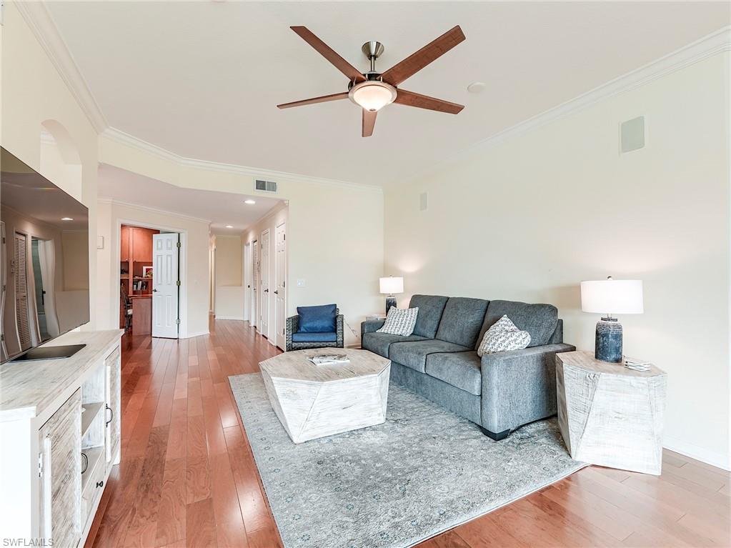 22921 Rosedale Drive, Unit 102 Estero, FL 34135 - Photo 10 of 33 a living room with furniture and a wooden floor