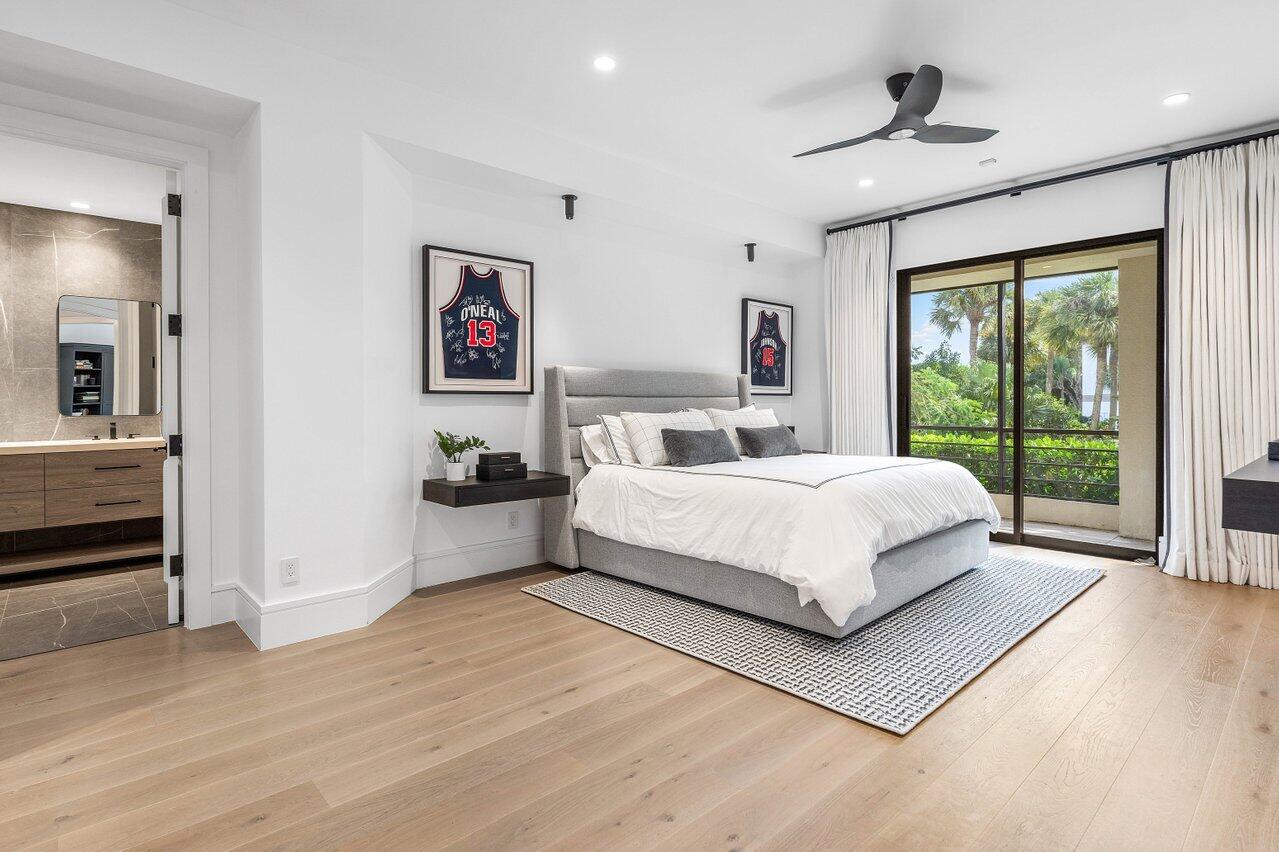 7383 Orangewood Lane, Unit 501 Boca Raton, FL 33433 - Photo 34 of 67 a bedroom with a bed and a large window