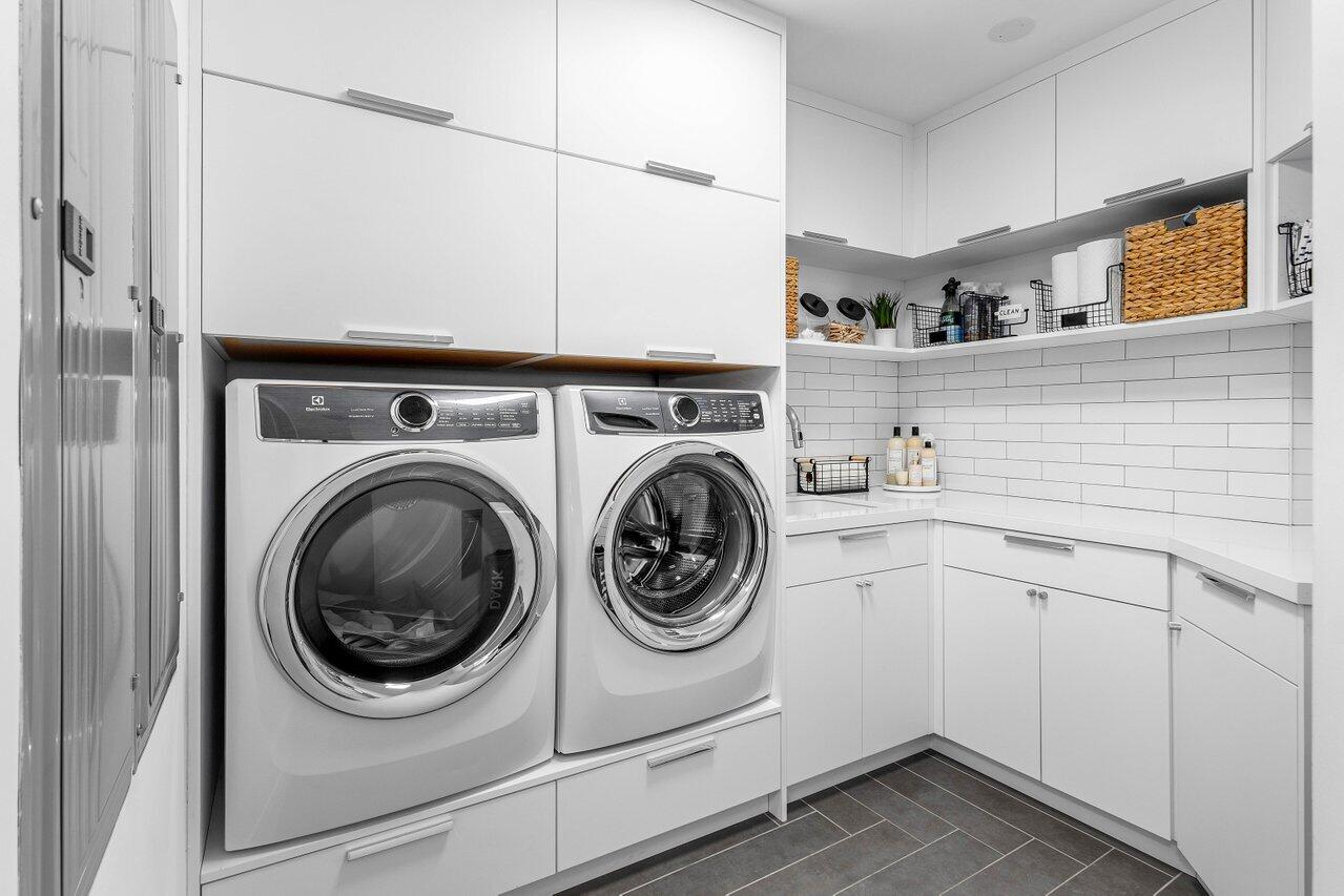 7383 Orangewood Lane, Unit 501 Boca Raton, FL 33433 - Photo 42 of 67 a utility room with sink dryer and washer