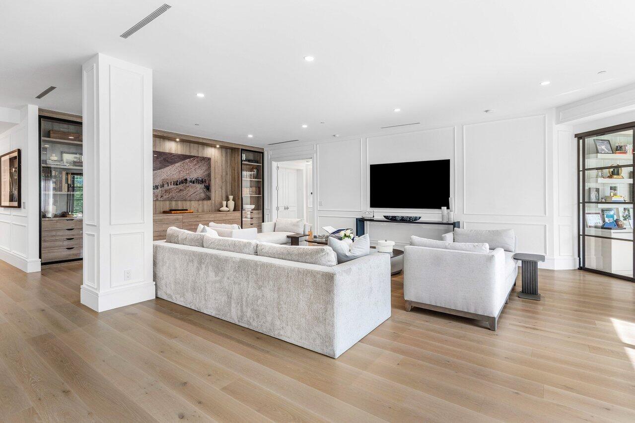 7383 Orangewood Lane, Unit 501 Boca Raton, FL 33433 - Photo 6 of 67 a living room with furniture and flat screen tv