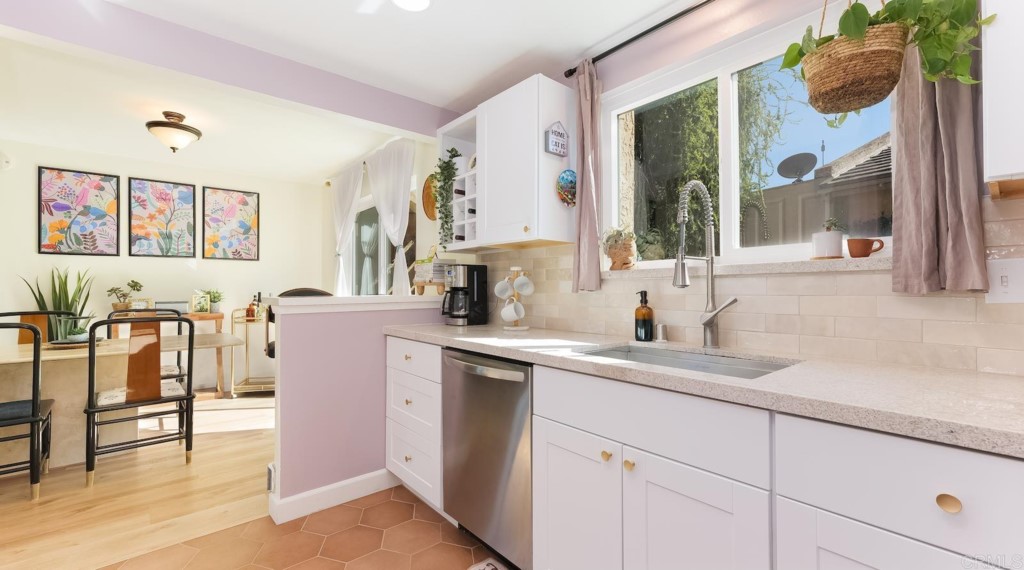 322 Ivy Lane Fallbrook, CA 92028 - Photo 14 of 35 a kitchen with cabinets and outdoor view