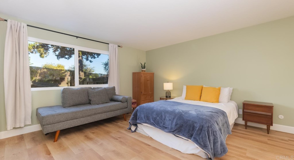 322 Ivy Lane Fallbrook, CA 92028 - Photo 19 of 35 a bedroom with a bed and a couch