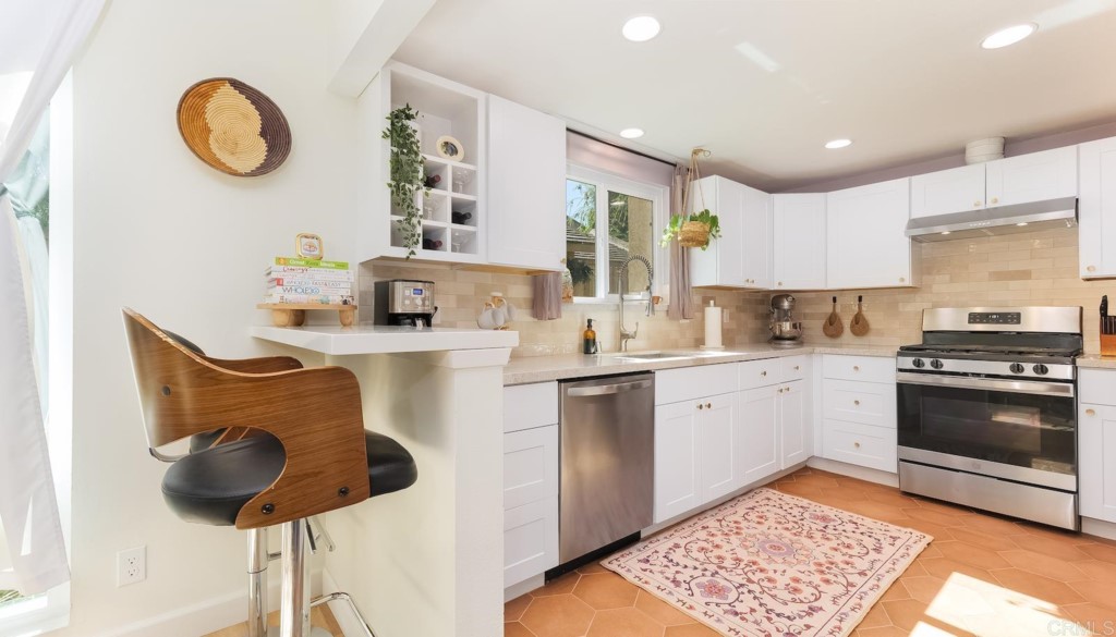 322 Ivy Lane Fallbrook, CA 92028 - Photo 2 of 35 a kitchen with a sink cabinets and window