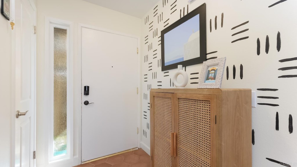 322 Ivy Lane Fallbrook, CA 92028 - Photo 5 of 35 a bathroom with a sink a mirror and shower