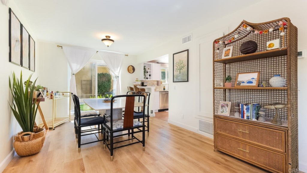 322 Ivy Lane Fallbrook, CA 92028 - Photo 8 of 35 a view of a dining room with furniture window and wooden floor