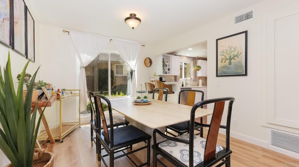 322 Ivy Lane Fallbrook, CA 92028 - Photo 10 of 35 a view of a dining room with furniture and wooden floor