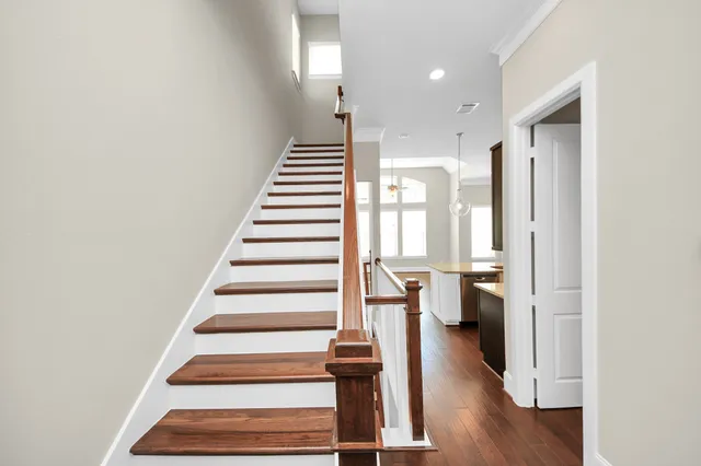 a view of entryway and hall with wooden floor