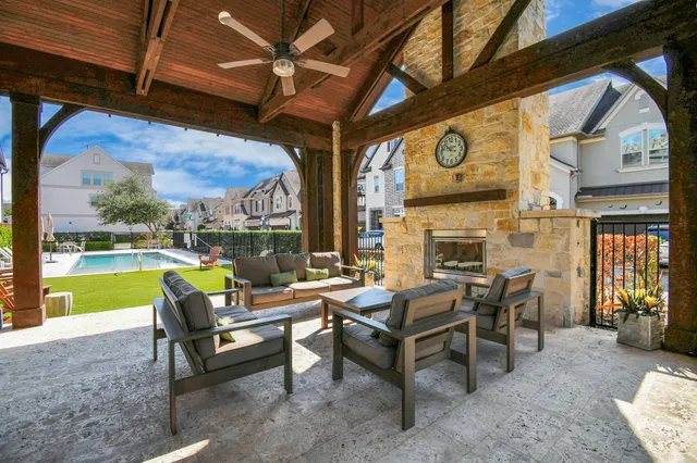 a building outdoor space with patio furniture and garden