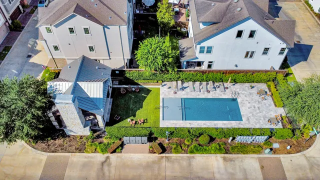 an aerial view of a house with a yard and garden