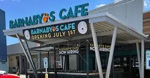 a view of a shop in a city