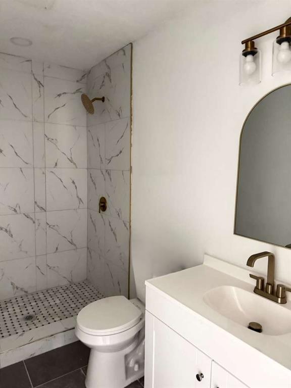 7367 Rountree Drive Riverdale, GA 30274 - Photo 13 of 18 a bathroom with a sink a toilet and shower